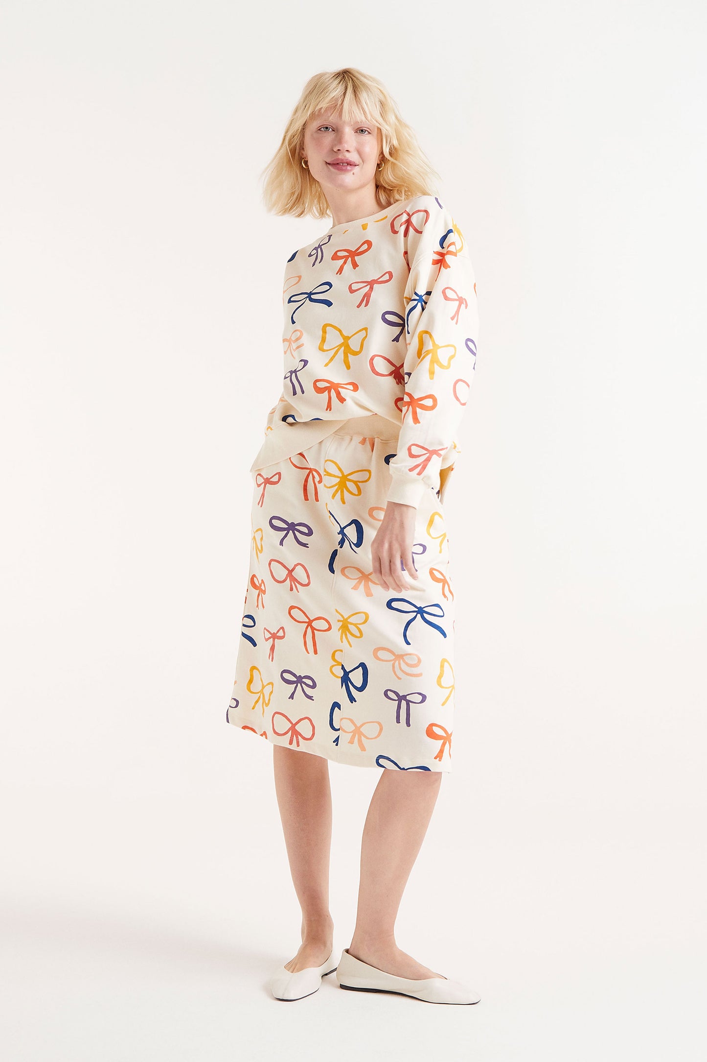 Compania Fantastică Cream skirt with Bow Detail.